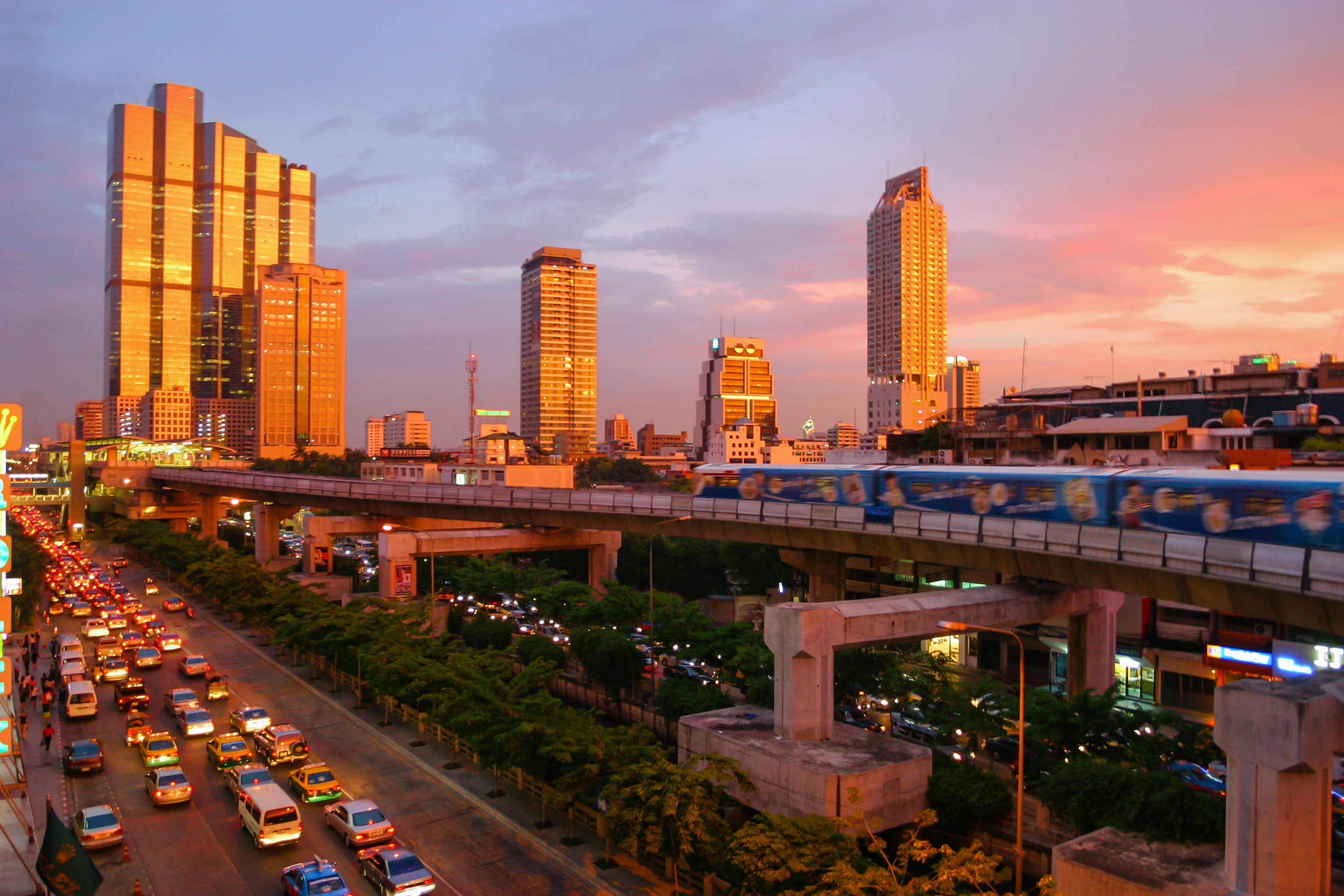 Bangkok BTS and traffic corridor at sunset